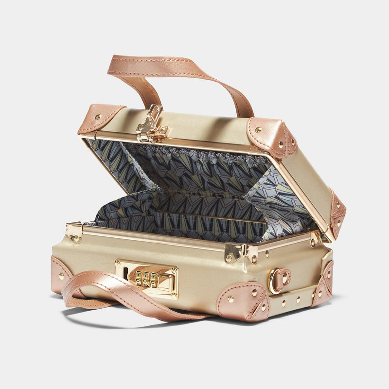Open product view of the mini Alchemist vegan leather suitcase in gold with art-deco print lining