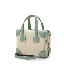 Angled product view of the mini Editor linen suitcase with sea green trims and shoulder attachment strap