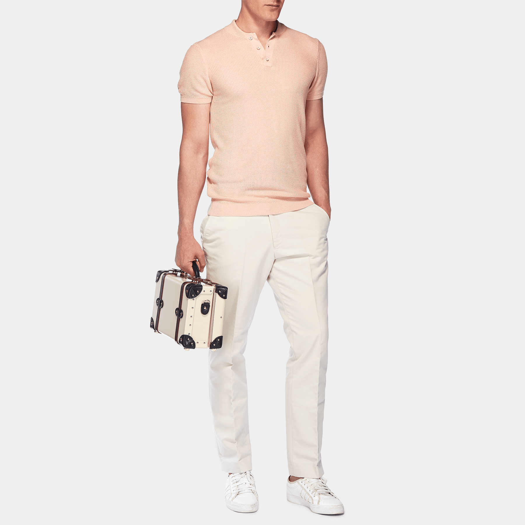 Male model with the vanity Architect leather suitcase in cream