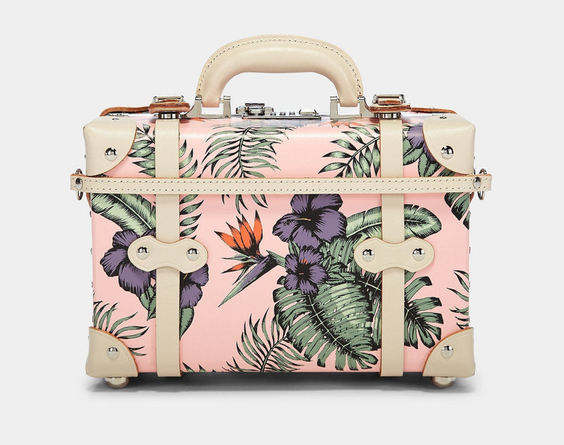 Product view of the vanity Botanist fibreboard suitcase in pink with suitcase attachment strap