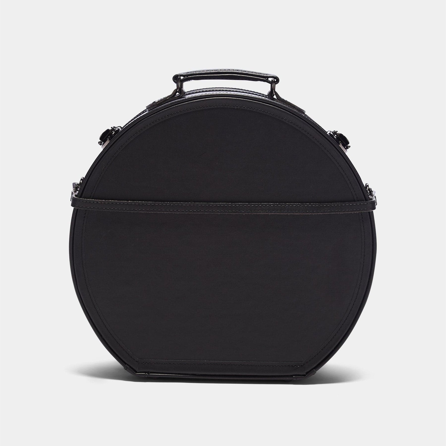 Back product view of the large hatbox Industrialist fibreboard suitcase in black with detachable suitcase strap