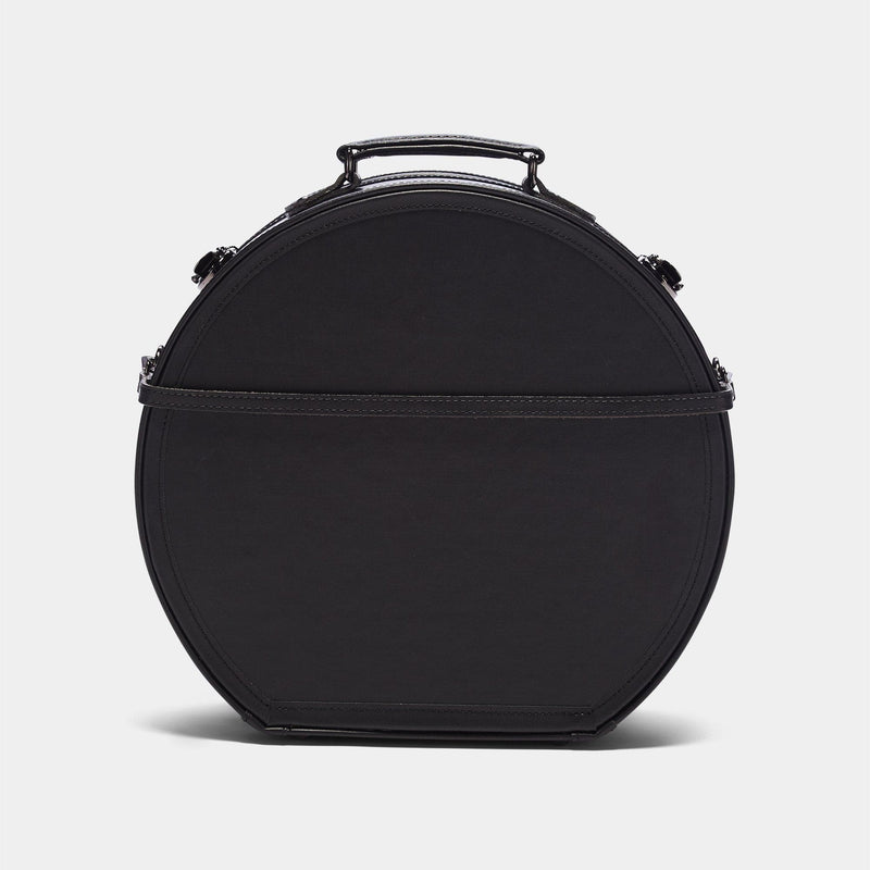 Back product view of the large hatbox Industrialist fibreboard suitcase in black with detachable suitcase strap