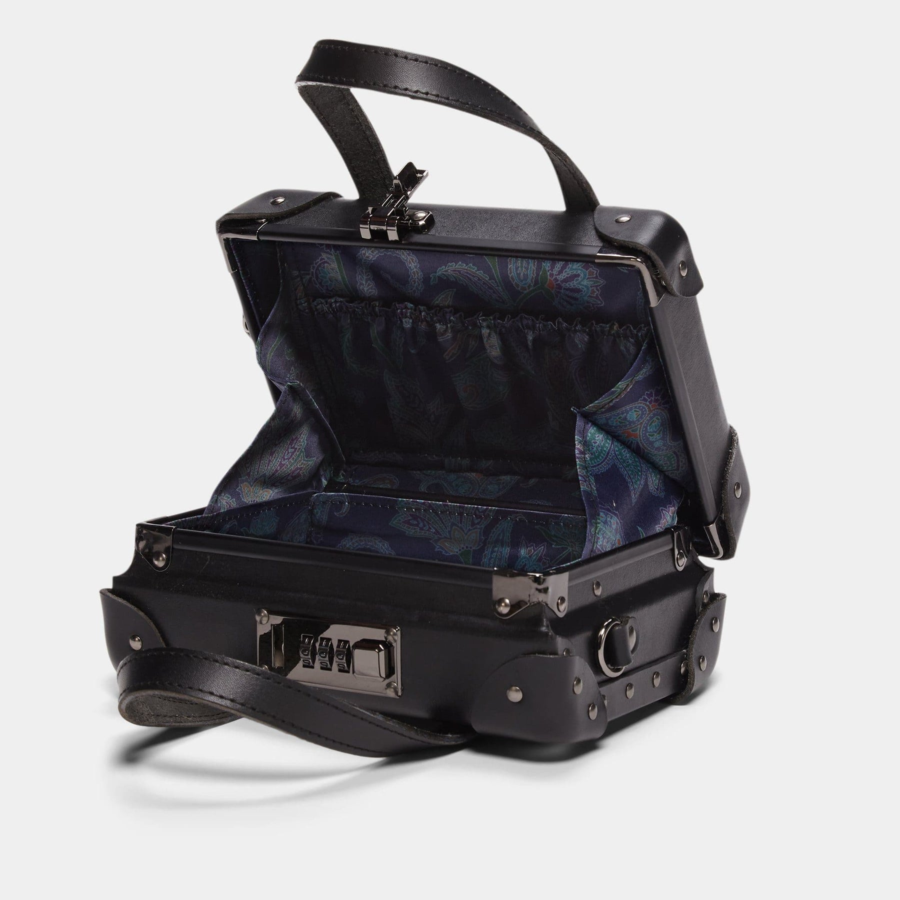Open product view of the mini Industrialist fibreboard suitcase in black with navy paisley print lining