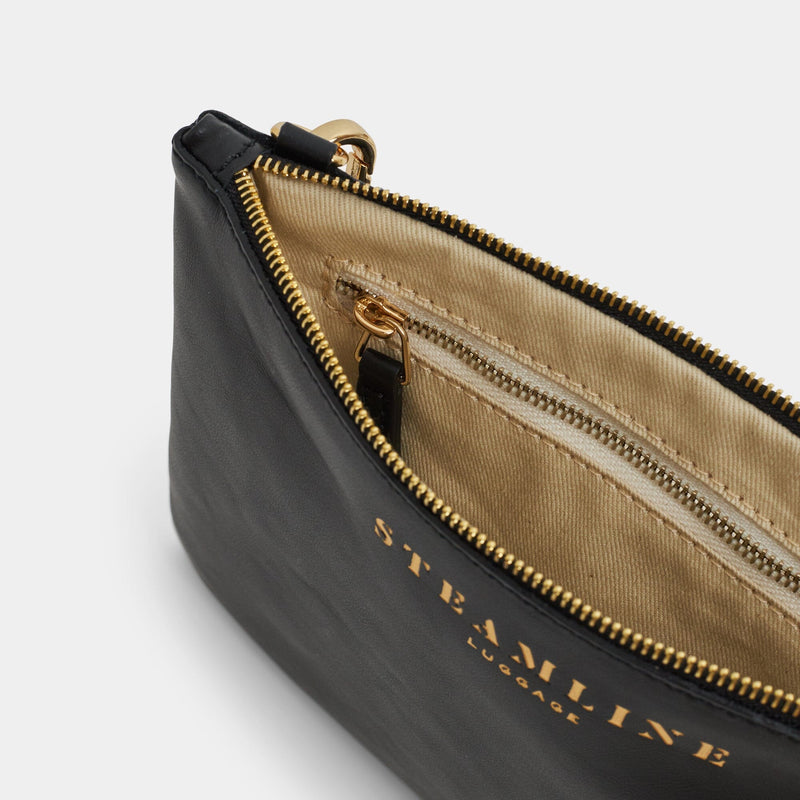 Open product view of the Navigator leather crossbody in black with gold trims and ecru lining