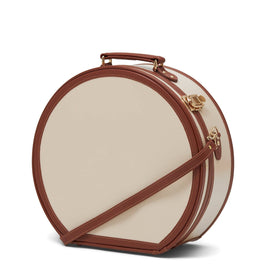 Angled product view of the deluxe hatbox Diplomat leather suitcase in cream with shoulder attachment strap