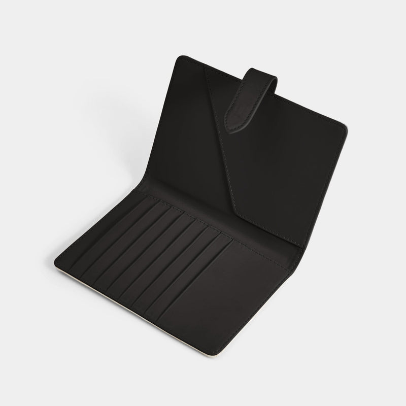 Open product view of the Navigator leather passport holder in black with black trim