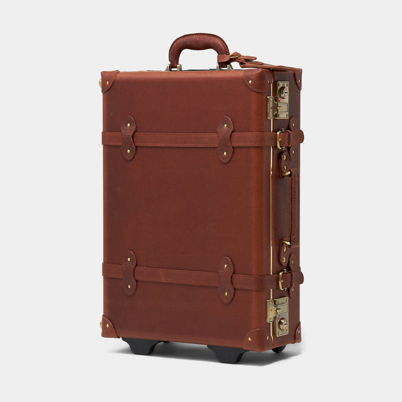 Angled product view of the stowaway Pioneer leather suitcase in brown