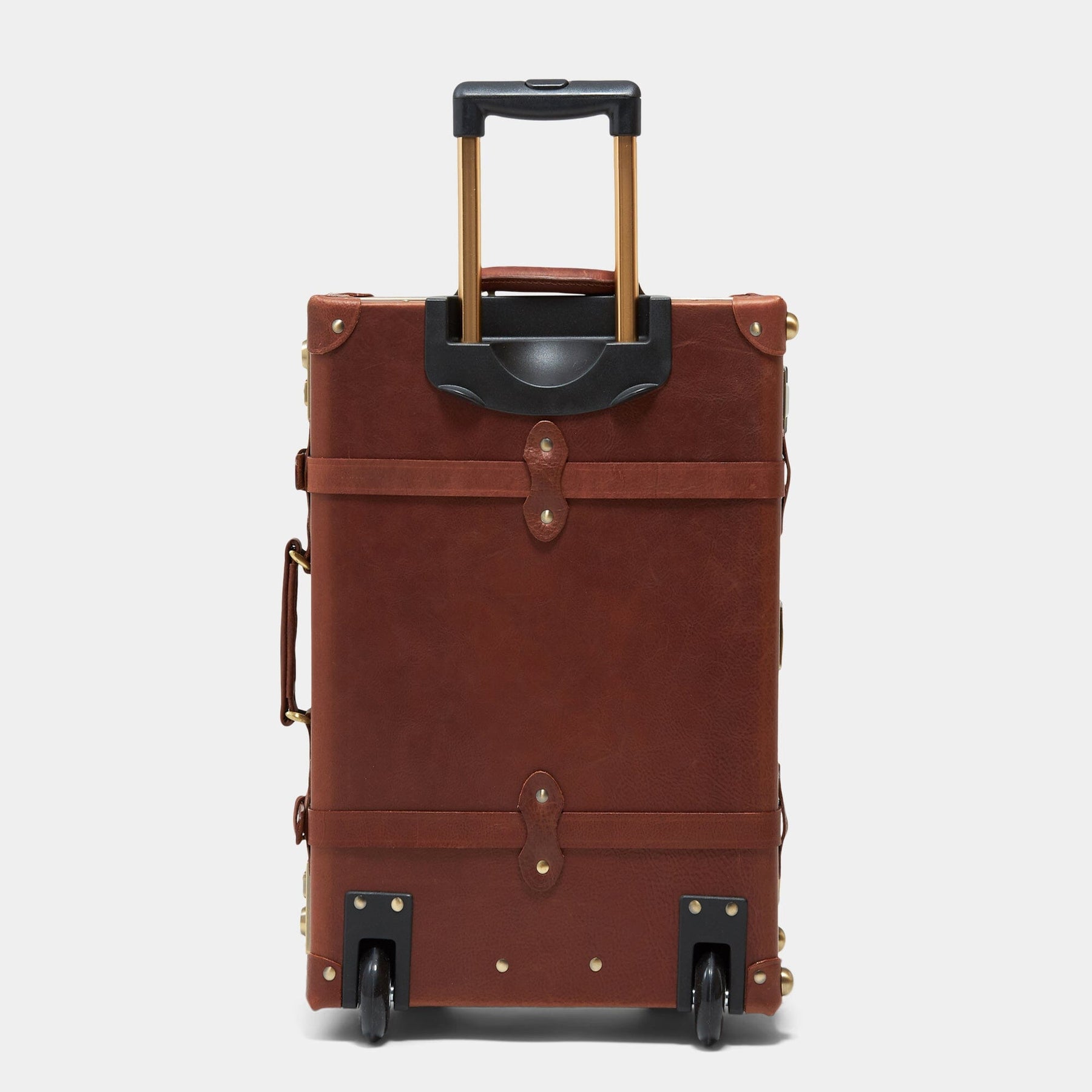 Back product view of the stowaway Pioneer leather suitcase in brown with raised handle