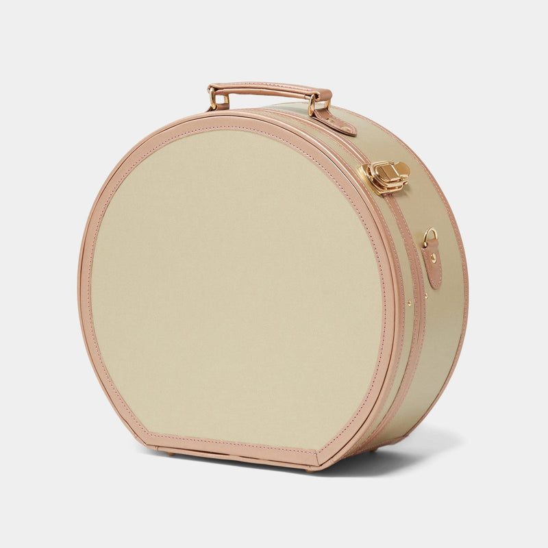 Angled product view of the large hatbox Alchemist vegan leather suitcase in gold 