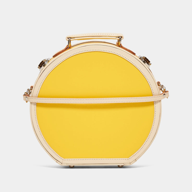 Back product view of the small hatbox Correspondent fibreboard suitcase in canary  yellow with detachable suitcase strap