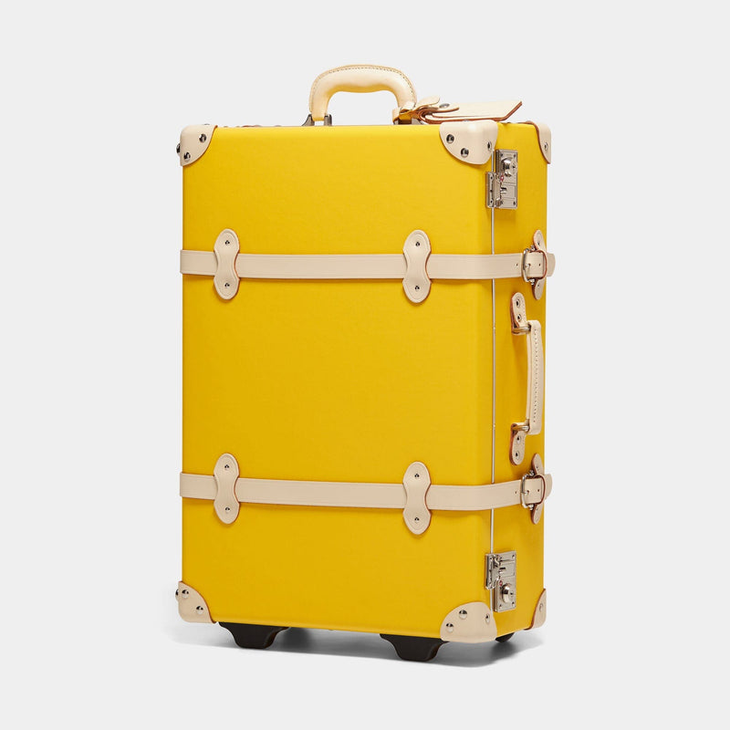 Angled product view of the stowaway Correspondent fibreboard suitcase in canary yellow