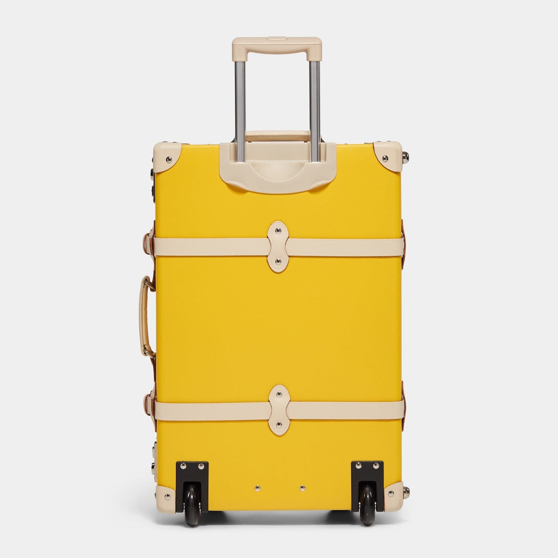 Back product view of the stowaway Correspondent fibreboard suitcase in canary yellow with raised handle