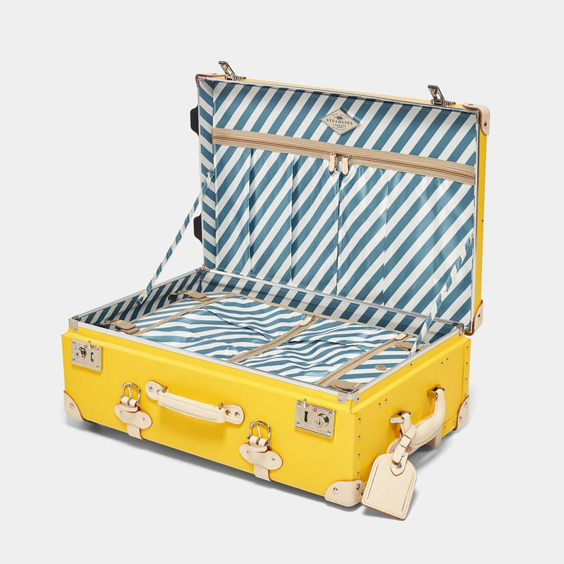 Open product view of the stowaway Correspondent fibreboard suitcase in canary yellow with blue-and-white striped printed lining