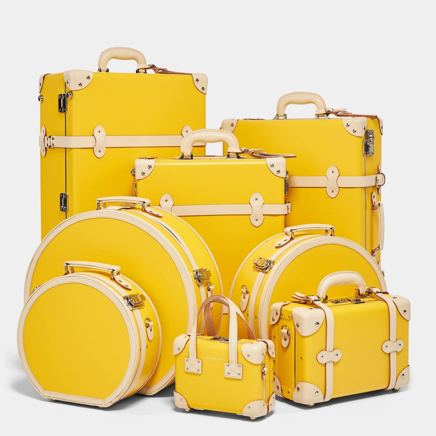 Steamline vintage luggage set of The Correspondent fibreboard suitcase in canary yellow