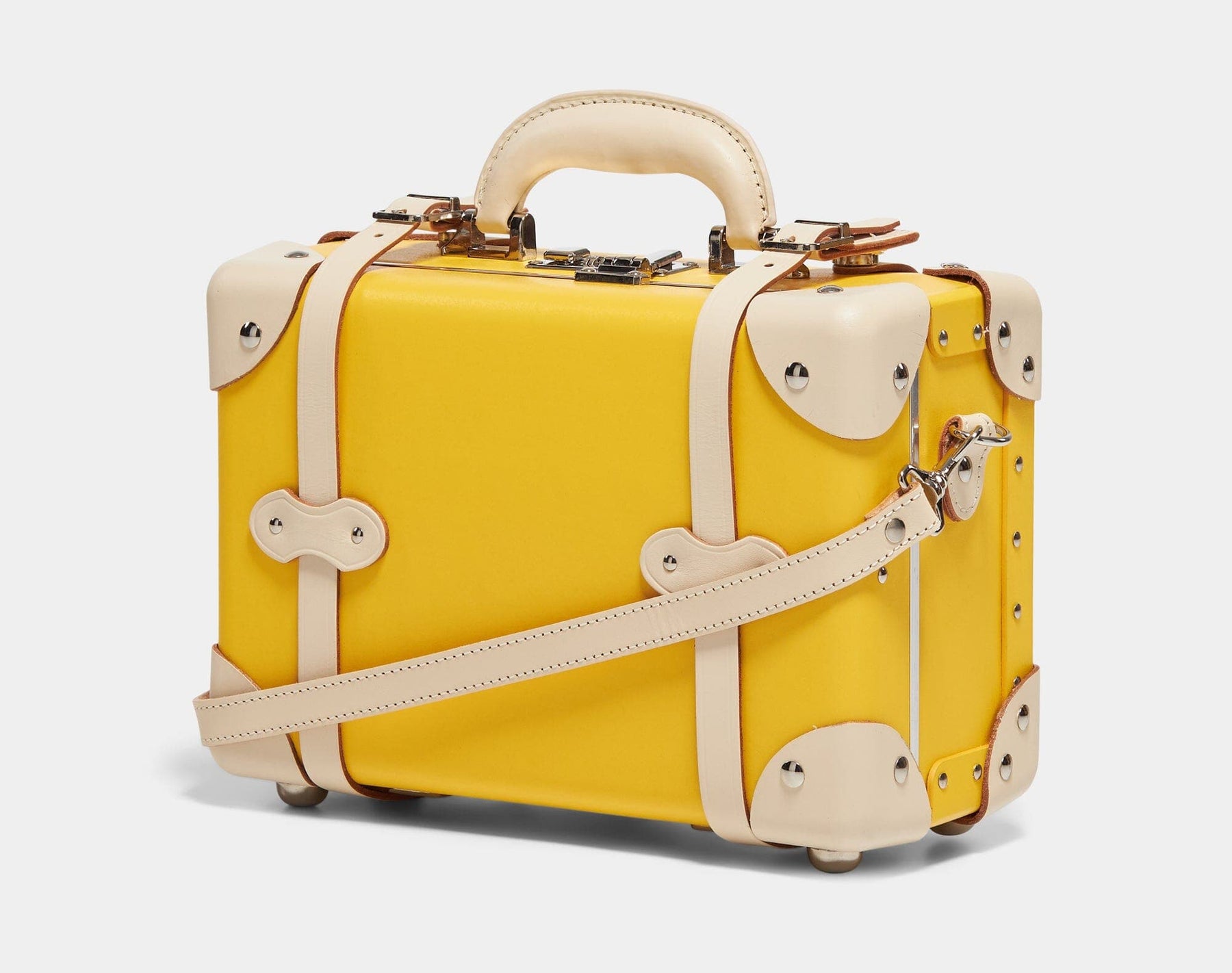 Angled product view of the vanity Correspondent fibreboard suitcase in canary yellow with shoulder attachement strap
