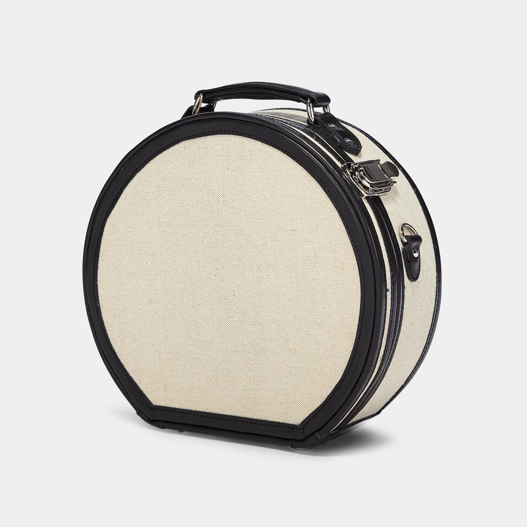 Angled product view of the small hatbox Editor linen suitcase with black trims