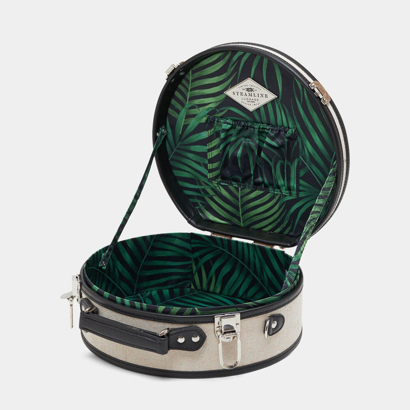 Open product view of the small hatbox Editor linen suitcase with black trims and palm-leaf print lining