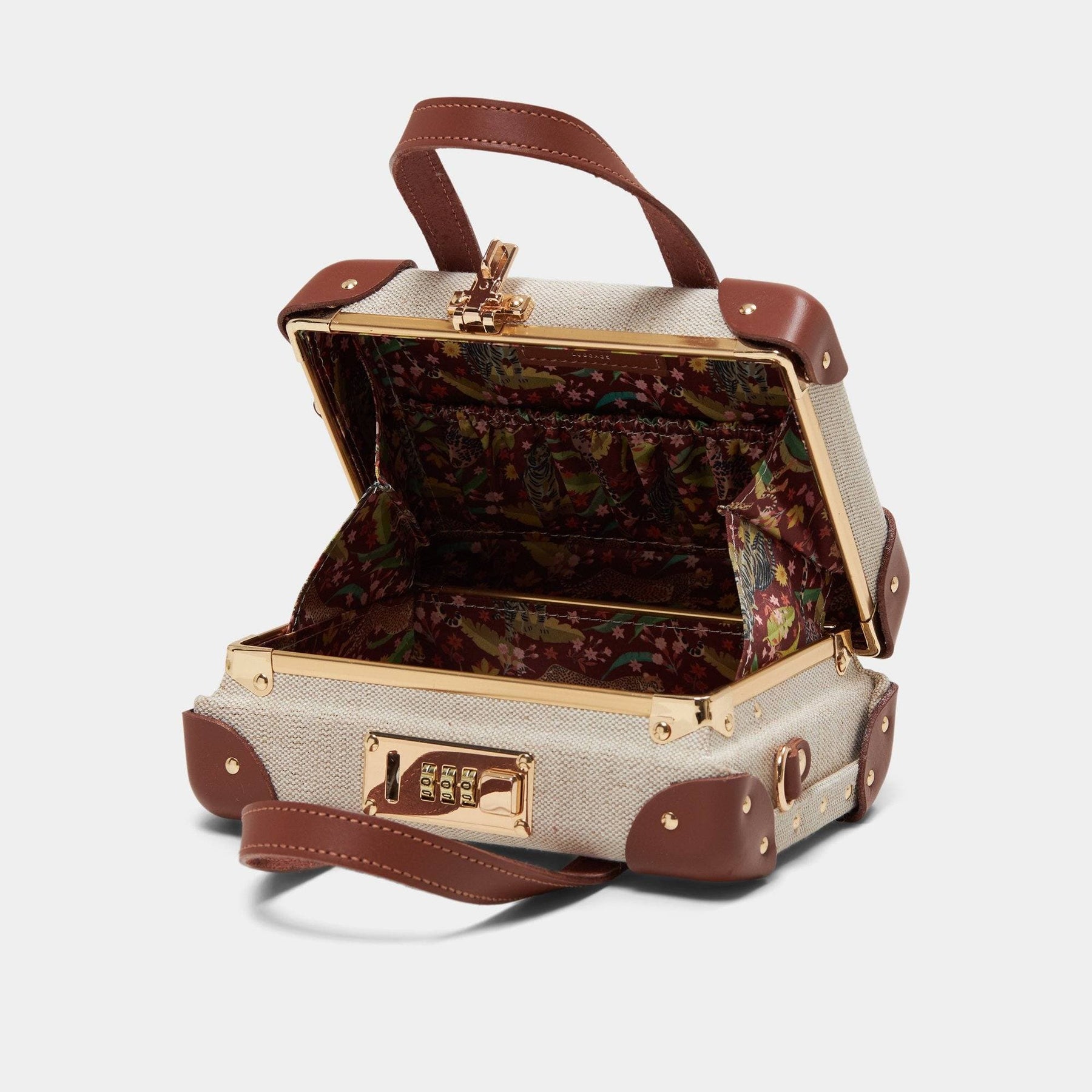 Open product view of the mini Editor linen suitcase with brown trims and exotic-bird print lining