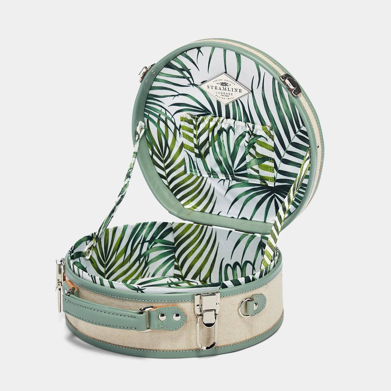 Open product view of the small hatbox Editor linen suitcase with sea green trims and palm-leaf print lining