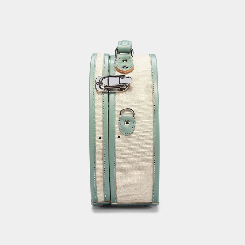 Side product view of the small hatbox Editor linen suitcase with sea green trims