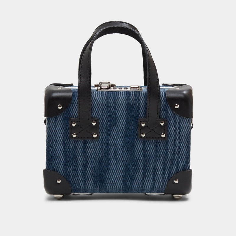 Back product view of the mini Editor linen suitcase with navy body and black trims 