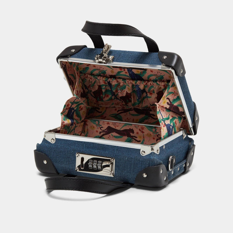 Open product view of the mini Editor linen suitcase with navy body, black trims and cheetah print lining