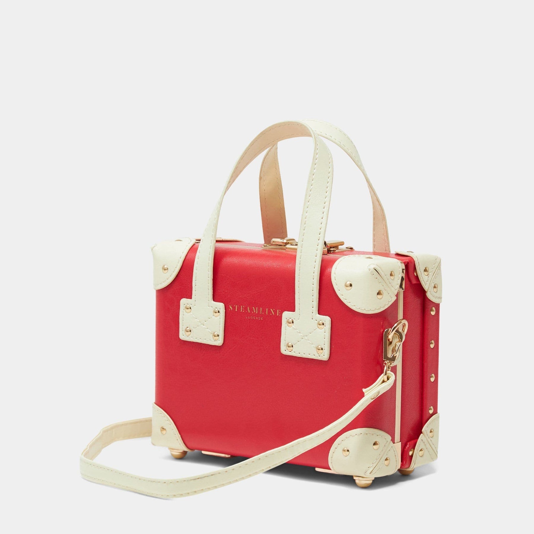 Angled product view of the mini Entrepreneur vegan leather suitcase in lipstick red with shoulder attachment strap