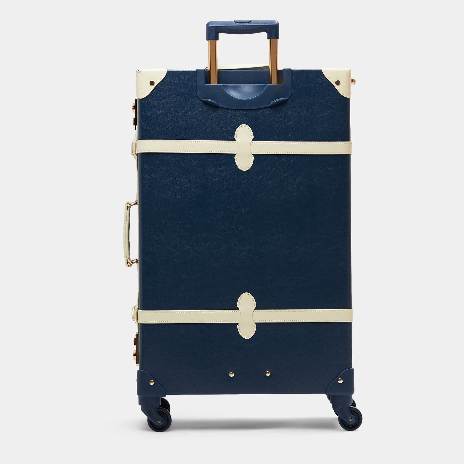 Back product view of the check-in spinner Entrepreneur vegan leather suitcase in navy with raised handle