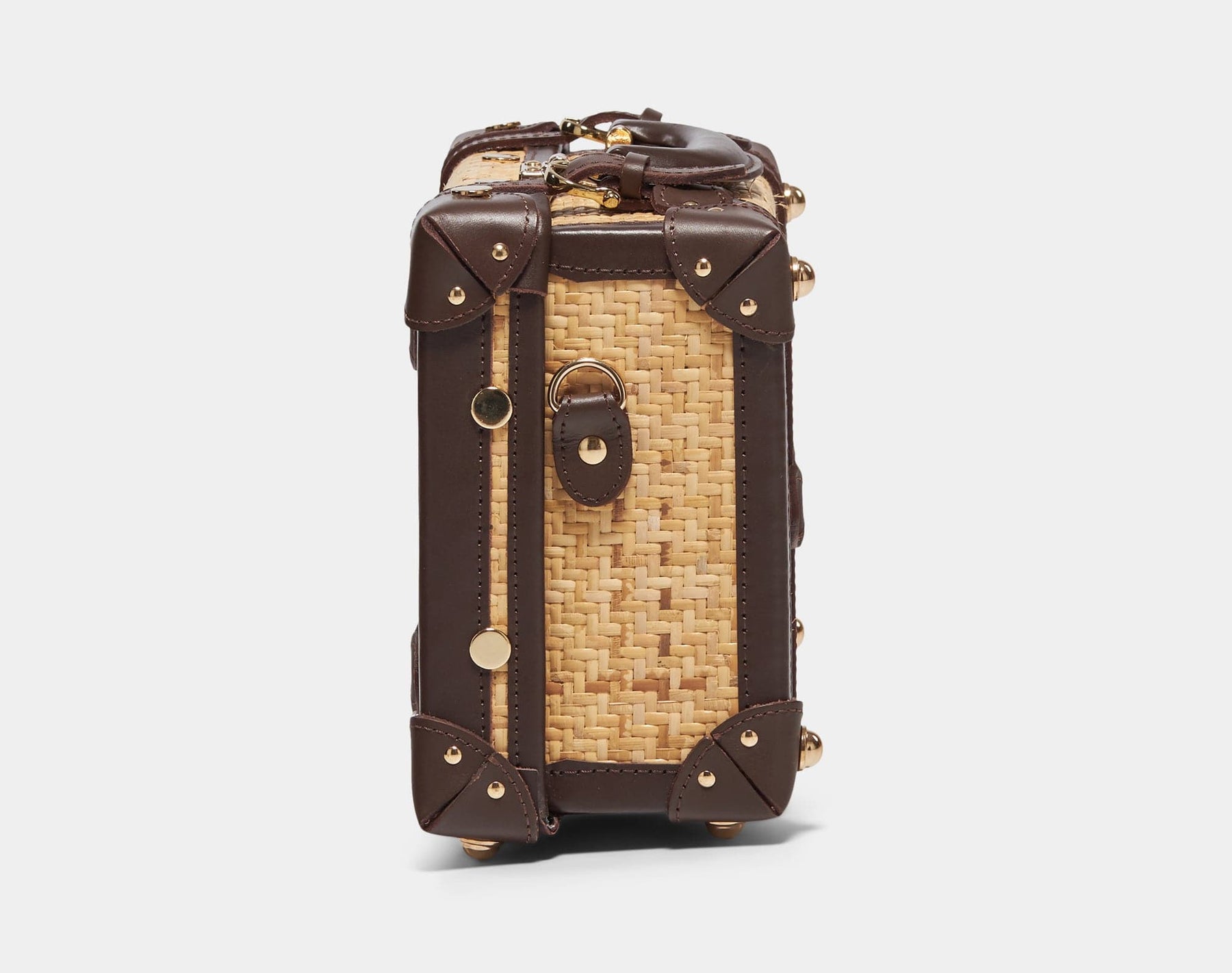 Side product view of the vanity Explorer rattan suitcase in natural wicker body and brown trims