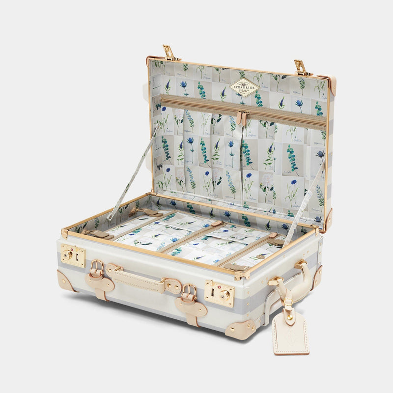 Open product view of the carry-on Illustrator fibreboard suitcase in blue-stripe with wildflower print lining