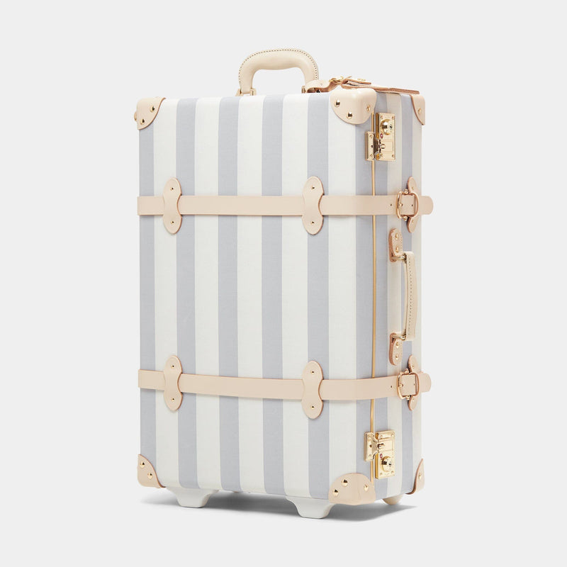 Angled product view of the stowaway Illustrator fibreboard suitcase in blue stripe