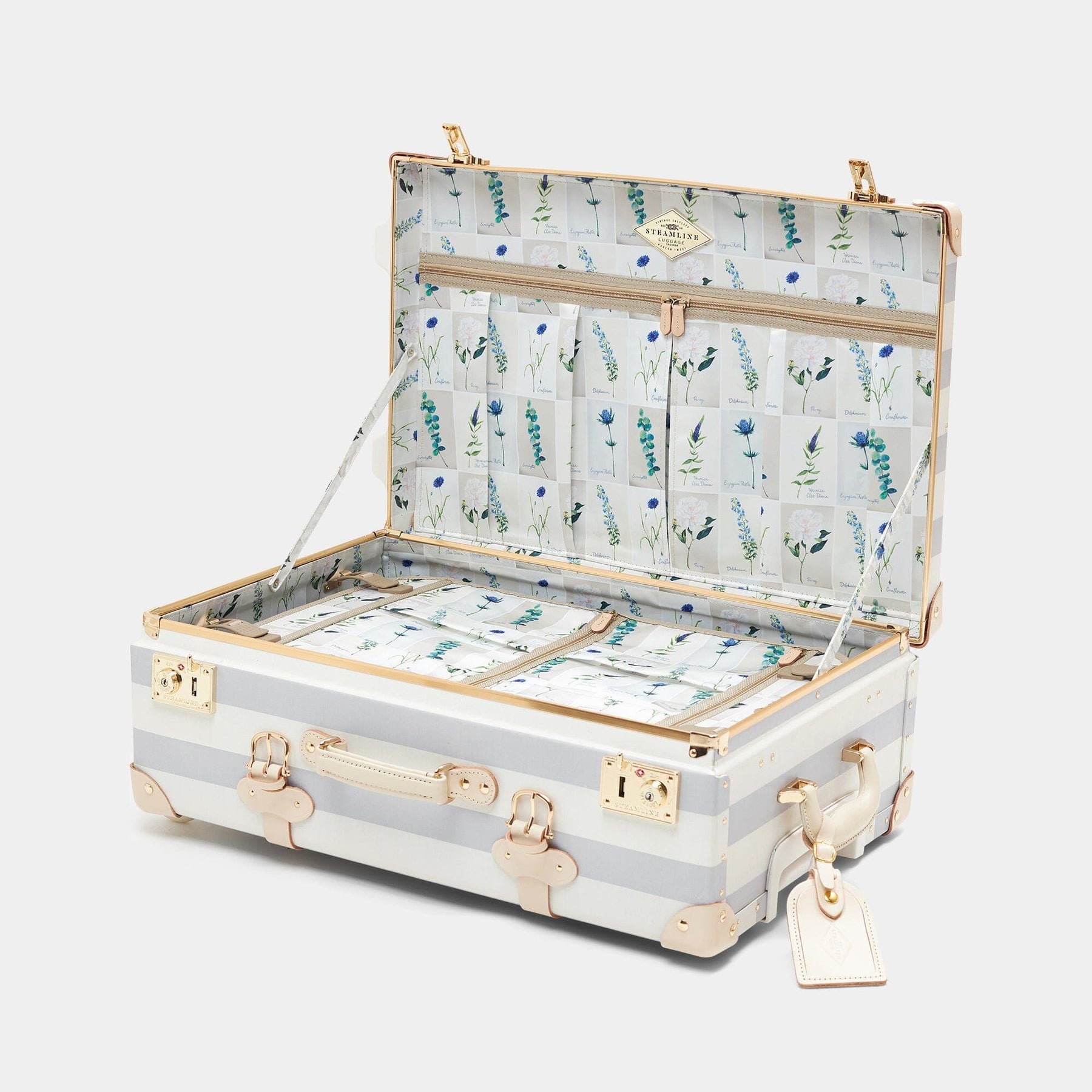 Open product view of the stowaway Illustrator fibreboard suitcase in blue stripe with wildflower printed lining