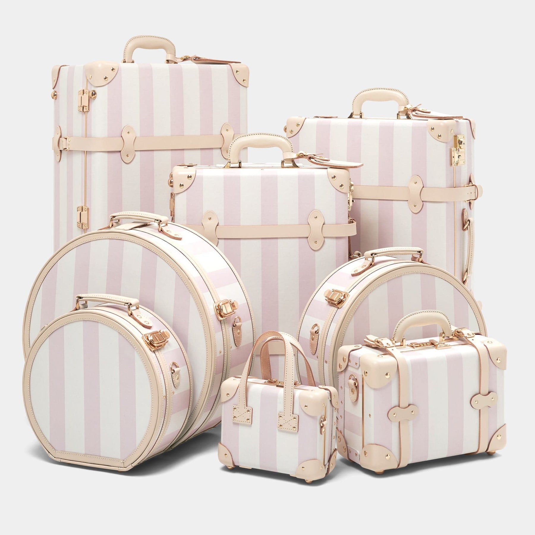 Designer luggage set of The Illustrator fibreboard suitcase in pink stripe