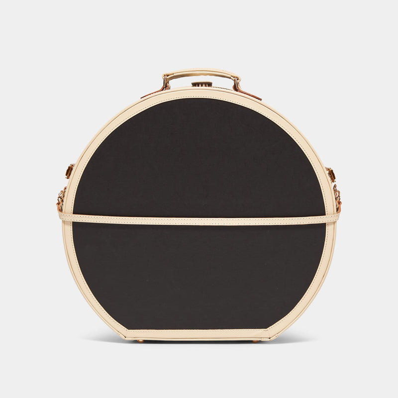 Product view of the deluxe hatbox Starlet fibreboard suitcase in black with detachable suitcase strap