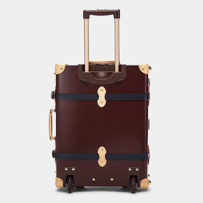 Back product view of the carry-on Architect leather suitcase in burgundy with raised handle