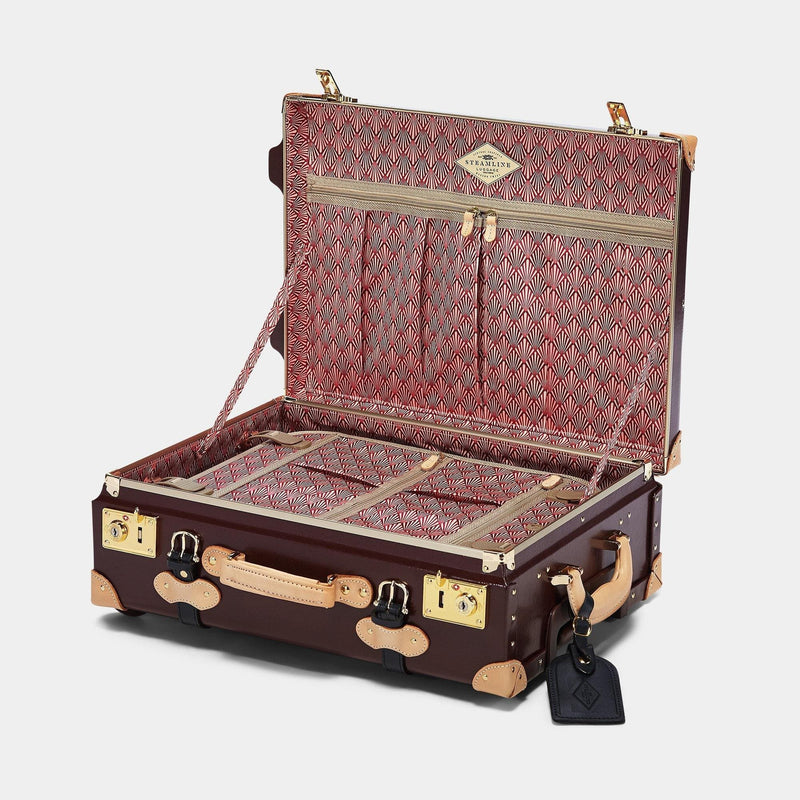 Open product view of the carry-on Architect leather suitcase in burgundy with art-deco printed lining and black leather luggage tag