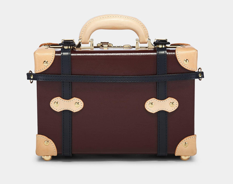 Product view of the vanity Architect leather suitcase in burgundy with suitcase attachment strap