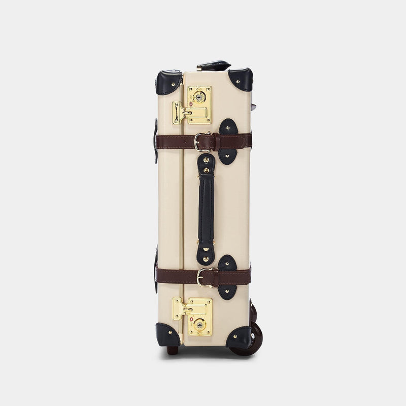 Side product view of the carry-on Architect leather suitcase in cream with raised handle