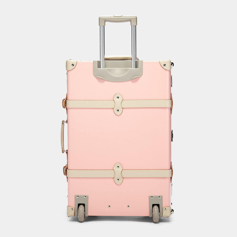 Back product view of the check-in Botanist fibreboard suitcase in pink with raised handle