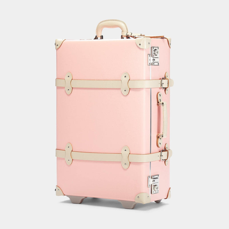 Angled product view of the check-in spinner Botanist fibreboard suitcase in pink