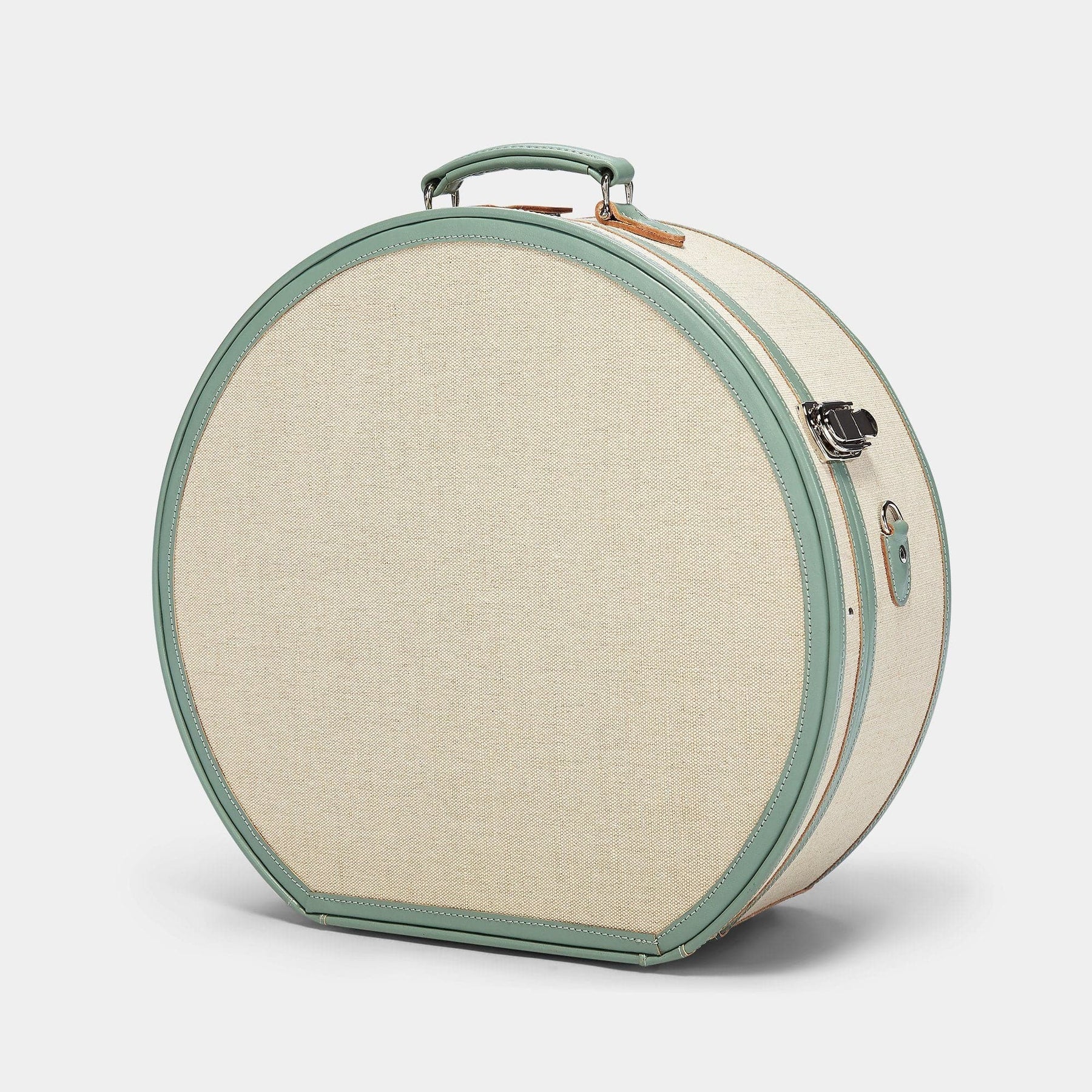 Angled product view of the deluxe hatbox Editor linen suitcase with sea green trims