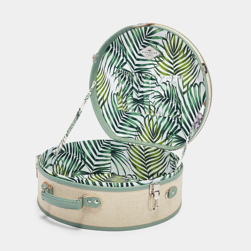 Open product view of the deluxe hatbox Editor linen suitcase with sea green trims and palm-leaf print lining