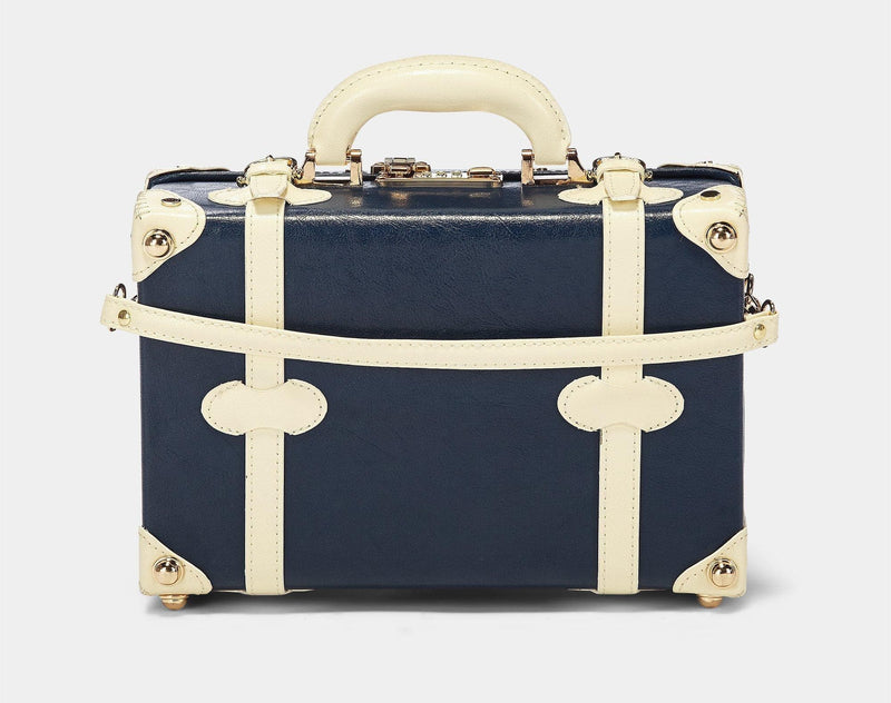 Back product view of the vanity Entrepreneur vegan leather suitcase in navy with detachable suitcase strap