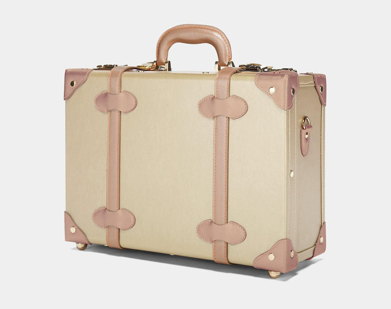 Angled product view of the overnighter Alchemist vegan leather suitcase in  gold 