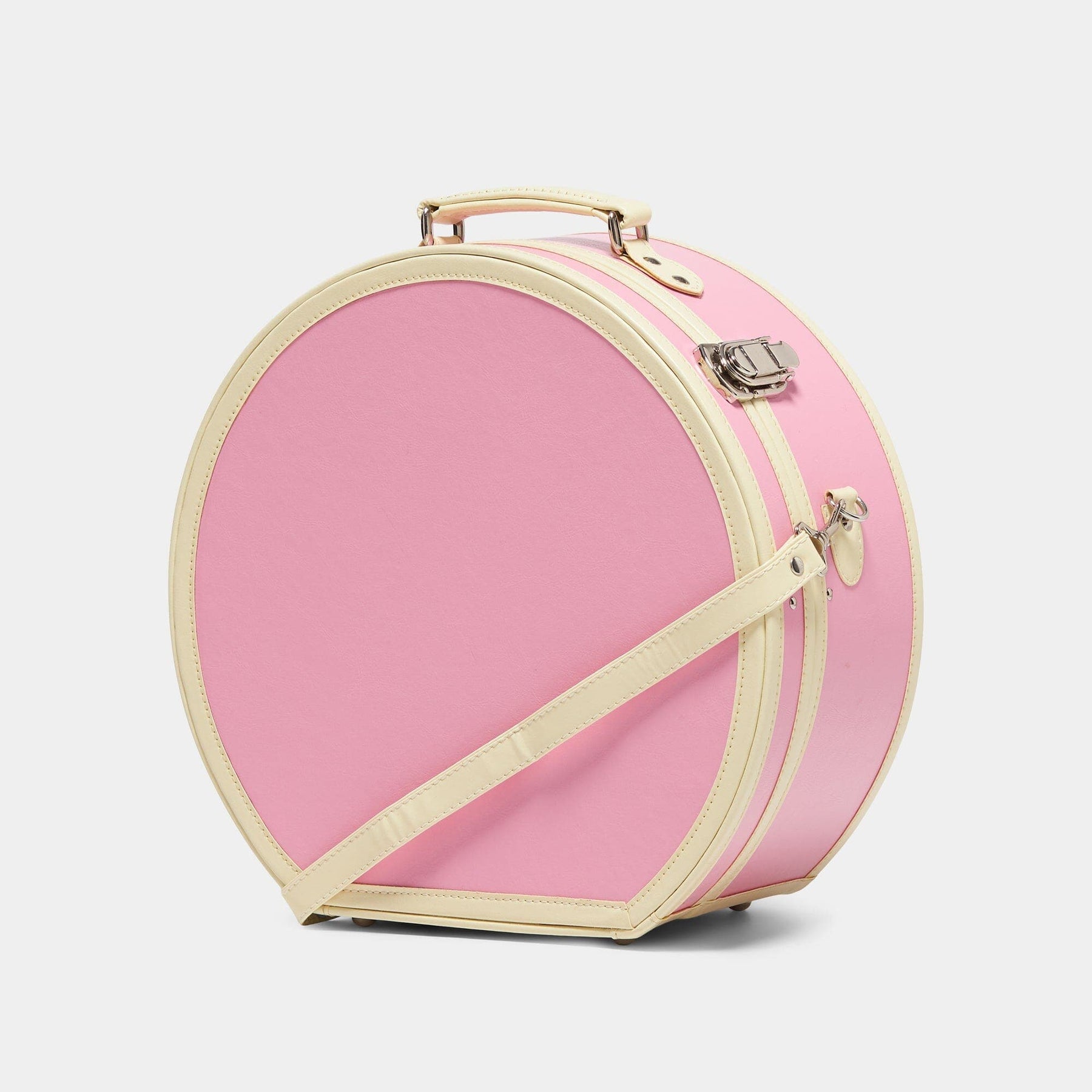 Angled product view of the large hatbox Entrepreneur vegan leather suitcase in pink with shoulder attachment strap