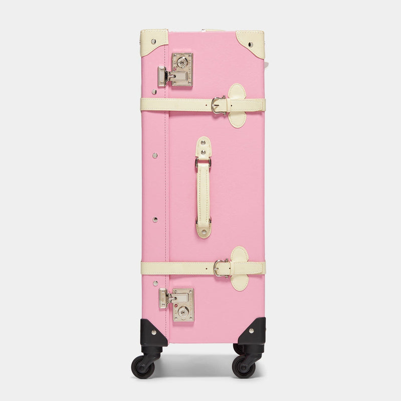 Side product view of the check-in spinner Entrepreneur vegan leather suitcase in pink with raised handle