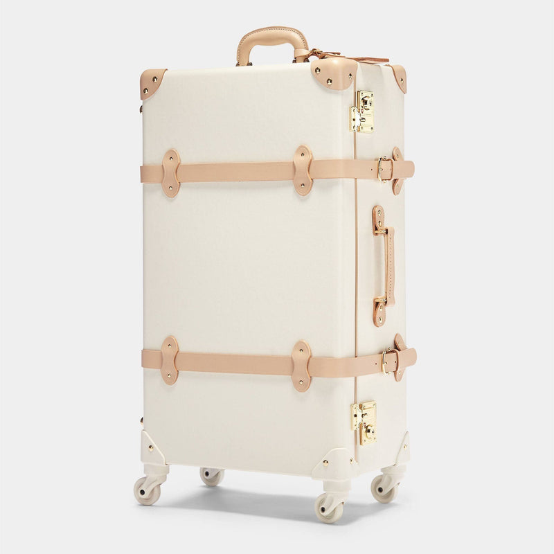 Angled product view of the check-in spinner Sweetheart fibreboard suitcase in cream